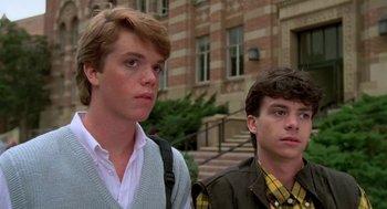 Movie still from “Night of the Creeps” (1986), directed by Fred Dekker – Two young men standing next to each other on a sidewalk; Close Up shot, Low angle