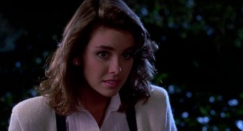 Movie still from “Night of the Creeps” (1986), directed by Fred Dekker – A person wearing a white shirt and suspenders; Close Up shot, Over the shoulder angle