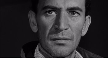 Movie still from “Night of the Eagle” (1962), directed by Sidney Hayers – Black and white close up of a man's face; Close Up shot, Low angle