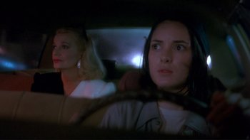 Movie still from “Night on Earth” (1991), directed by Jim Jarmusch – Two women in a car at night looking at the camera; Close Up shot, Over the shoulder angle