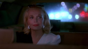 Movie still from “Night on Earth” (1991), directed by Jim Jarmusch – A woman sitting in the back seat of a car; Close Up shot, Over the shoulder angle