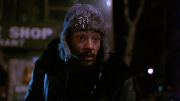 Movie still from “Night on Earth” (1991), directed by Jim Jarmusch – A man wearing a fur hat and a jacket; Close Up shot, Low angle
