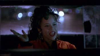 Movie still from “Night on Earth” (1991), directed by Jim Jarmusch – A woman with curly black hair in a car; Close Up shot, Low angle