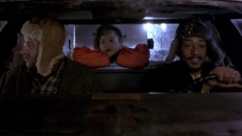 Movie still from “Night on Earth” (1991), directed by Jim Jarmusch – A group of people looking into a mirror; Medium shot, Over the shoulder angle