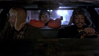 Movie still from “Night on Earth” (1991), directed by Jim Jarmusch – Two men and a girl looking out of a window; Close Up shot, Over the shoulder angle