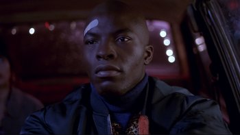 Movie still from “Night on Earth” (1991), directed by Jim Jarmusch – A person in a car; Close Up shot, Low angle