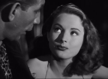 Movie still from “Nightmare Alley” (1947), directed by Edmund Goulding – A man and a woman looking at one another; Close Up shot, Over the shoulder angle