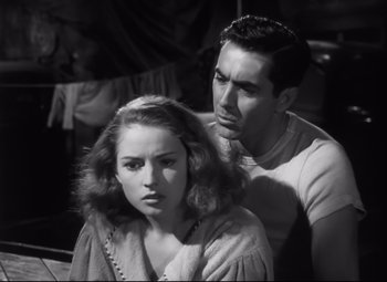 Movie still from “Nightmare Alley” (1947), directed by Edmund Goulding – A man and a woman looking at each other; Close Up shot, High angle