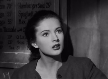Movie still from “Nightmare Alley” (1947), directed by Edmund Goulding – A black - and - white photo of a young woman; Close Up shot, Low angle