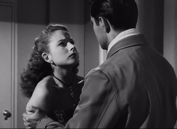 Movie still from “Nightmare Alley” (1947), directed by Edmund Goulding – A man and a woman are looking at each other; Close Up shot, Over the shoulder angle