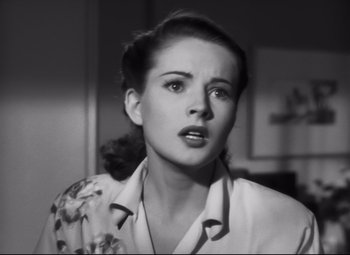 Movie still from “Nightmare Alley” (1947), directed by Edmund Goulding – A black - and - white photo of a young woman looking at the camera; Close Up shot, Low angle