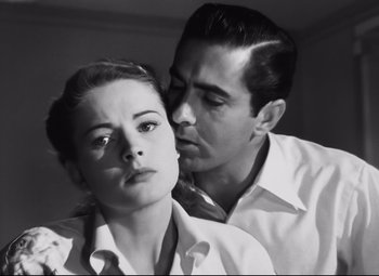 Movie still from “Nightmare Alley” (1947), directed by Edmund Goulding – A man and a woman in a black and white photo; Close Up shot, Low angle