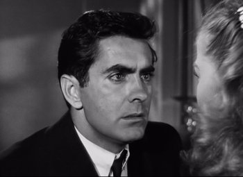 Movie still from “Nightmare Alley” (1947), directed by Edmund Goulding – Black and white photograph of a man and a woman; Close Up shot, Over the shoulder angle