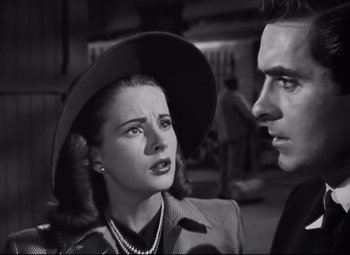 Movie still from “Nightmare Alley” (1947), directed by Edmund Goulding – A man and a woman looking at one another; Close Up shot, Low angle