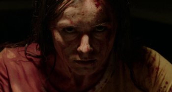 Movie still from “Nightmare Cinema” (2018), directed by Alejandro Brugués – A person with blood all over their face; Close Up shot, Low angle