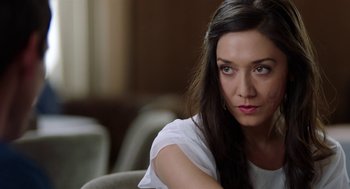 Movie still from “Nightmare Cinema” (2018), directed by Alejandro Brugués – A woman sitting in a chair looking at the camera; Close Up shot, Over the shoulder angle