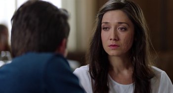 Movie still from “Nightmare Cinema” (2018), directed by Alejandro Brugués – A woman sitting in front of a man in front of a window; Close Up shot, Over the shoulder angle