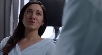 Movie still from “Nightmare Cinema” (2018), directed by Alejandro Brugués – A person sitting in a chair; Close Up shot, Over the shoulder angle