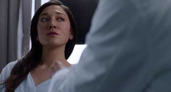 Movie still from “Nightmare Cinema” (2018), directed by Alejandro Brugués – A person looking at something; Close Up shot, Over the shoulder angle