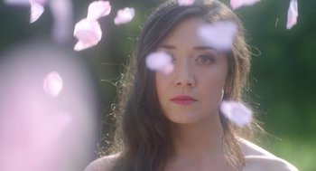 Movie still from “Nightmare Cinema” (2018), directed by Alejandro Brugués – A beautiful young lady with long dark brown hair; Close Up shot, Low angle