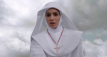 Movie still from “Nightmare Cinema” (2018), directed by Alejandro Brugués – A woman in a nun's outfit with a cross necklace; Close Up shot, Low angle