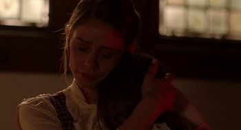 Movie still from “Nightmare Cinema” (2018), directed by Alejandro Brugués – A woman holding a cell phone in her hands; Close Up shot, Over the shoulder angle