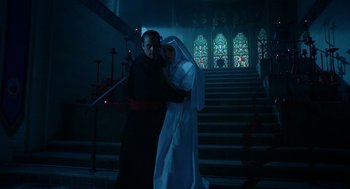 Movie still from “Nightmare Cinema” (2018), directed by Alejandro Brugués – A man and a woman dressed as a priest and a nun; Wide shot, Low angle