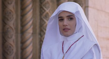 Movie still from “Nightmare Cinema” (2018), directed by Alejandro Brugués – A woman wearing a white veil and a necklace; Close Up shot, Over the shoulder angle
