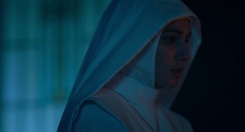 Movie still from “Nightmare Cinema” (2018), directed by Alejandro Brugués – A woman wearing a nun's habit and a white veil; Close Up shot, Low angle