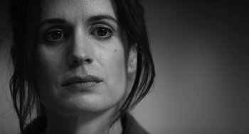 Movie still from “Nightmare Cinema” (2018), directed by Alejandro Brugués – Black and white photograph of a woman's face; Close Up shot, Low angle