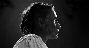 Movie still from “Nightmare Cinema” (2018), directed by Alejandro Brugués – A woman with a very long hair is looking to the side; Close Up shot, Low angle