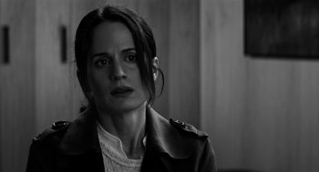 Movie still from “Nightmare Cinema” (2018), directed by Alejandro Brugués – Black and white photograph of a woman looking at the camera; Close Up shot, Over the shoulder angle