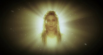 Movie still from “Nightmare Cinema” (2018), directed by Alejandro Brugués – A woman with dreadlocks is in the middle of a light beam; Close Up shot, Low angle