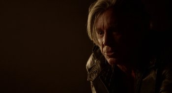 Movie still from “Nightmare Cinema” (2018), directed by Alejandro Brugués – A man with blonde hair is looking at the camera; Close Up shot, Over the shoulder angle