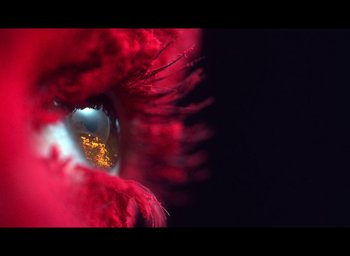 Movie still from “Nights of Cabiria” (1957), directed by Federico Fellini – The eye of a person with red paint; Extreme Close Up shot, High angle