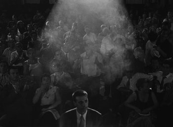Movie still from “Nights of Cabiria” (1957), directed by Federico Fellini – A crowd of people sitting in front of an audience; Wide shot, High angle