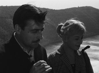 Movie still from “Nights of Cabiria” (1957), directed by Federico Fellini – A man and a woman standing next to each other; Close Up shot, Low angle