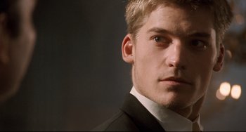 A person wearing a suit and tie