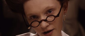 Movie still from “Nightwatching” (2007), directed by Peter Greenaway – A person wearing a pair of glasses; Extreme Close Up shot, Low angle