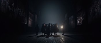 Movie still from “Nightwatching” (2007), directed by Peter Greenaway – A group of people standing in the middle of a street; Extreme Wide shot, High angle