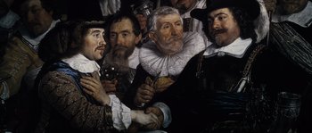 Movie still from “Nightwatching” (2007), directed by Peter Greenaway – A group of men standing next to each other holding wine glasses; Close Up shot, Over the shoulder angle