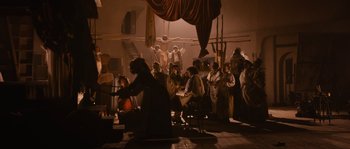 Movie still from “Nightwatching” (2007), directed by Peter Greenaway – A group of people gathered in a room; Wide shot, High angle