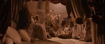 Movie still from “Nightwatching” (2007), directed by Peter Greenaway – A group of people sitting on the floor of a room; Wide shot, High angle
