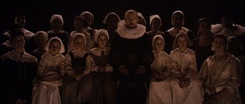 Movie still from “Nightwatching” (2007), directed by Peter Greenaway – A group of people wearing hats and costumes; Medium shot, High angle