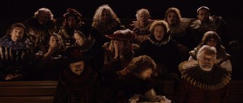 Movie still from “Nightwatching” (2007), directed by Peter Greenaway – A group of people dressed in renaissance costumes; Wide shot, High angle