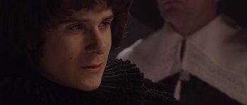 Movie still from “Nightwatching” (2007), directed by Peter Greenaway – A person wearing a suit and tie; Close Up shot, High angle