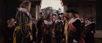 Movie still from “Nightwatching” (2007), directed by Peter Greenaway – A group of people dressed in historical costumes; Wide shot, Over the shoulder angle