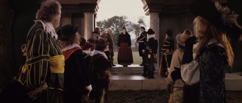 Movie still from “Nightwatching” (2007), directed by Peter Greenaway – A group of people dressed in period clothing; Wide shot, Over the shoulder angle