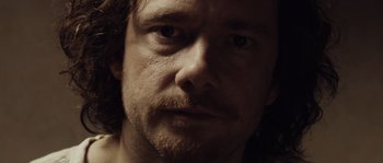 Movie still from “Nightwatching” (2007), directed by Peter Greenaway – A person with a beard; Extreme Close Up shot, Over the shoulder angle