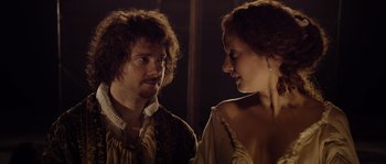 Movie still from “Nightwatching” (2007), directed by Peter Greenaway – A man and a woman standing next to each other in front of a mirror; Close Up shot, Over the shoulder angle